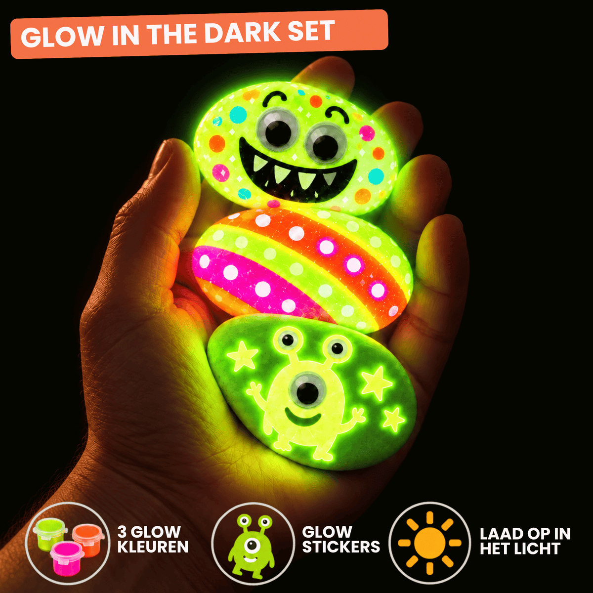 Drie beschilderde Happy Stones met glow in the dark verf en stickers die oplichten in het donker
