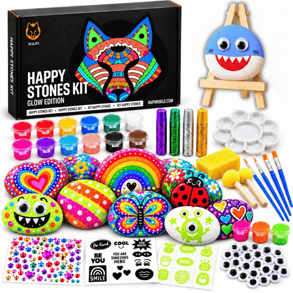 Napi Happy Stones Kit Glow Edition met beschilderde stenen, verf, glitterlijm, stickers en een haaiensteen op de mini ezel